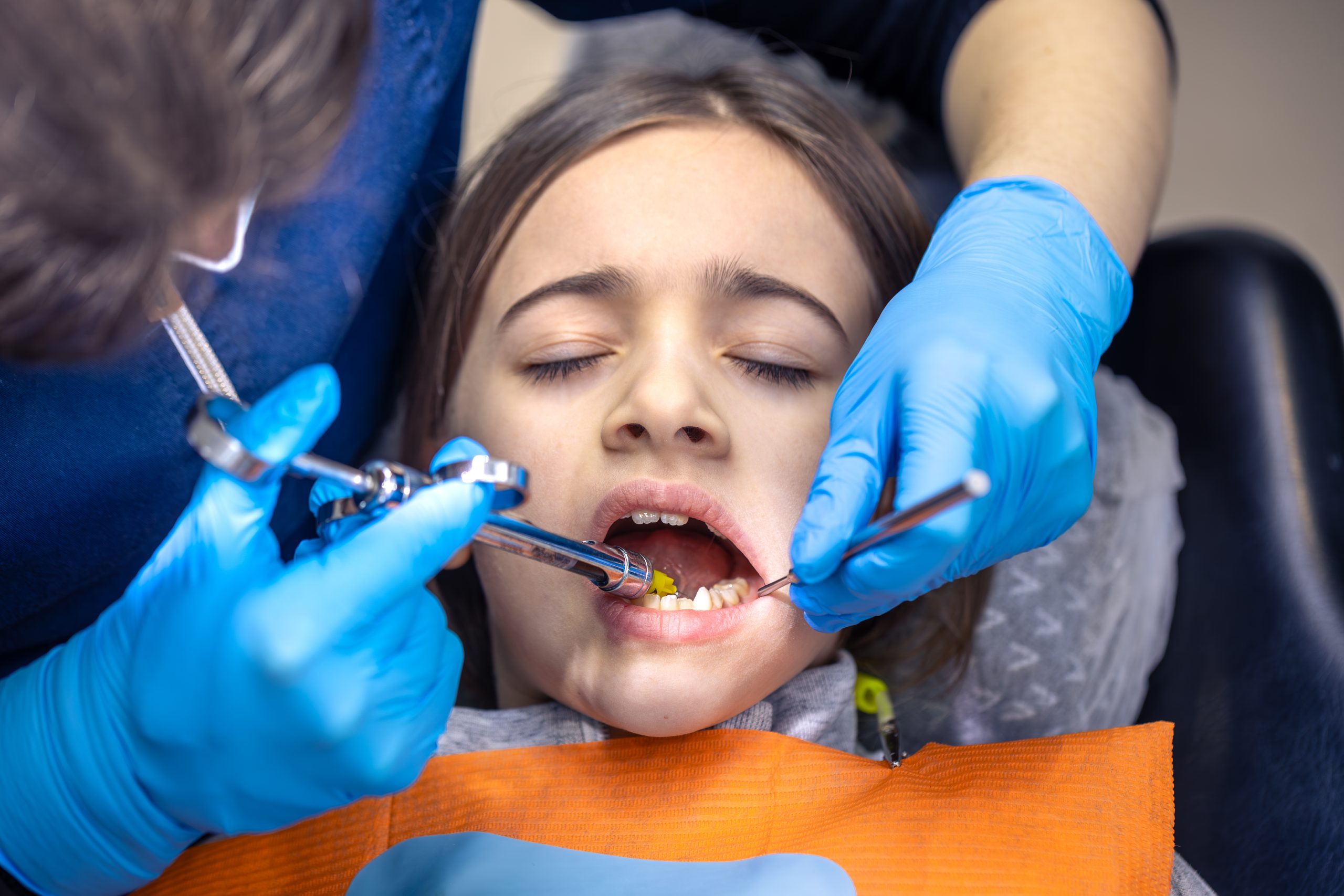 Child with a knocked-out tooth receiving emergency dental care